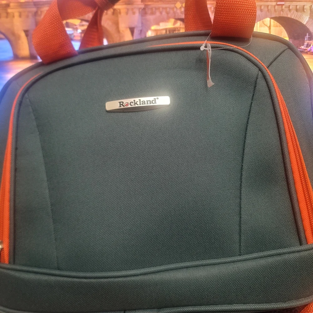 Vibrant Green and Orange Travel Bags for Adventurers